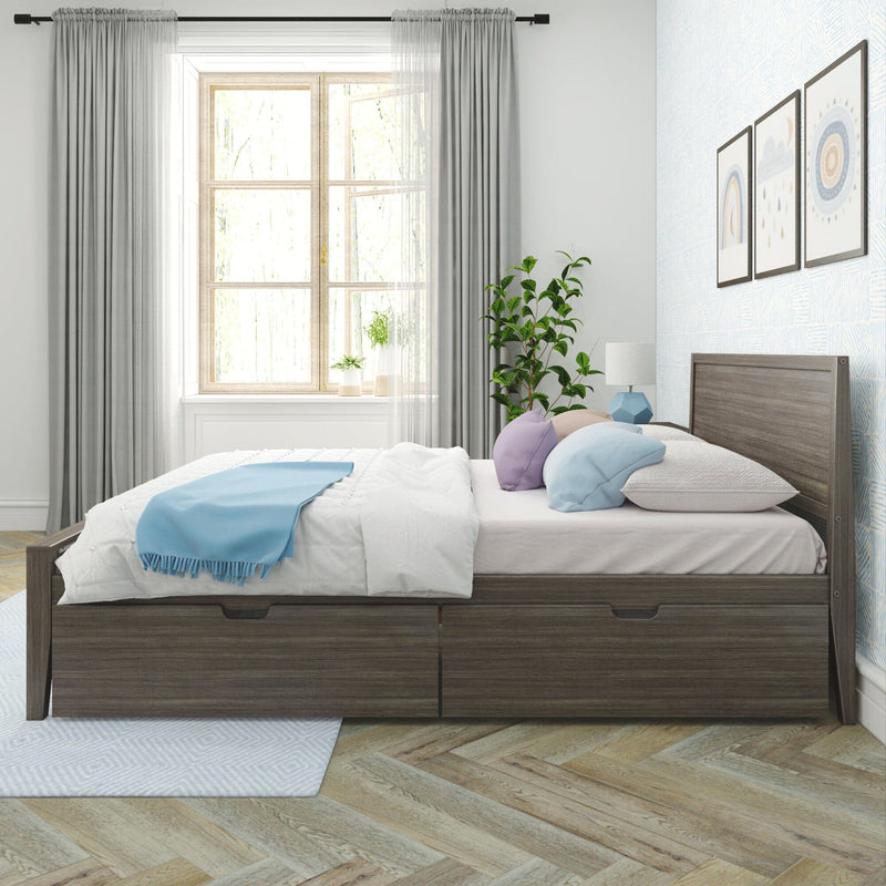 Modern Scandinavian bedroom with dark wood storage bed, white bedding and blue throw, pastel pillows, potted plant, window with sheer grey curtains and framed wall art