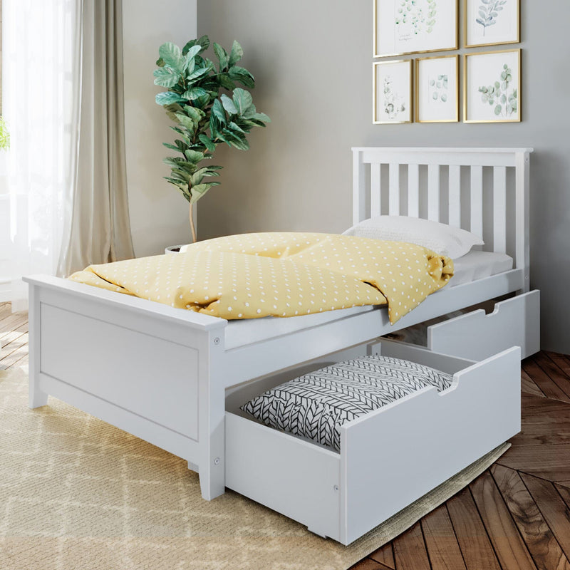 White wooden children's bed with pull-out storage drawers and yellow polka-dot duvet in modern nursery with fiddle-leaf plant and framed botanical art