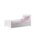 White single wooden children's bed with pink sheets, pillows and textured throw, built-in under-bed storage drawers