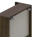 Close-up of dark walnut cabinet top showing sliding door roller hardware, metal wheel and mounting brackets on wood veneer