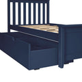 Close-up of navy blue wooden platform bed frame with vertical slatted headboard, exposed wooden mattress slats and built-in underbed storage drawers