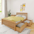 Minimalist bedroom with modern wooden storage bed and open under-bed drawers, yellow bedding, plant and framed fruit wall art