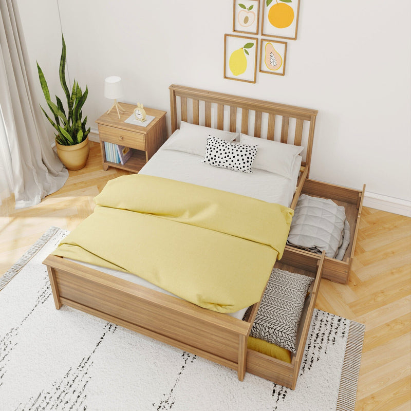Scandinavian bedroom with wooden storage bed and open drawers, yellow duvet, polka-dot pillow, nightstand lamp, potted plant