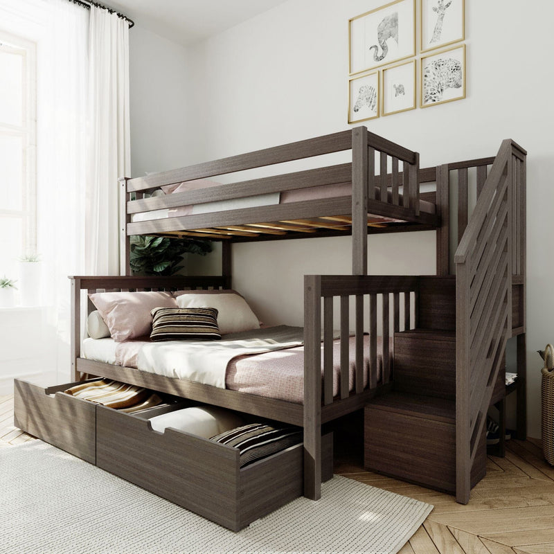 Modern dark wood bunk bed with built-in storage drawers and staircase, neutral bedding and wall art in bright kids' bedroom