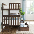 Dark walnut solid wood twin-over-twin bunk bed with slatted guardrails, built-in ladder and pull-out storage drawers, styled in a bright kids’ bedroom with white bedding, blue curtains and potted plant