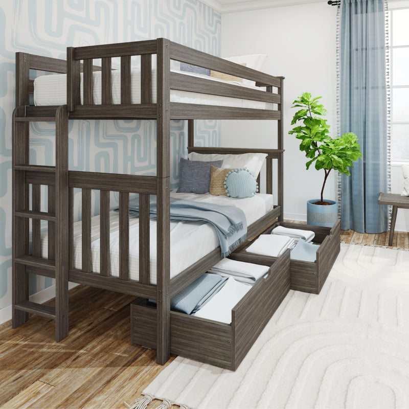 Gray wood twin bunk bed with pull-out under-bed storage drawers in modern kids bedroom with blue accents, patterned wallpaper and potted plant