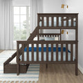 Dark wood twin-over-twin bunk bed with blue bedding and under-bed storage in bright modern children's bedroom with white curtains and brass wall sconces