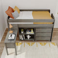 Twin loft bed with built-in desk and storage drawers in gray wood, mustard yellow bedding, orange and striped pillows, lamp, cactus and bookshelf — modern kids bedroom decor