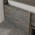 Close-up of rustic weathered gray wood headboard with white fabric backing and metal mounting clips, modern farmhouse bedroom decor