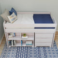 White loft bed with built-in shelves and drawers, navy bedding and pillows on blue patterned rug — kids' bedroom storage