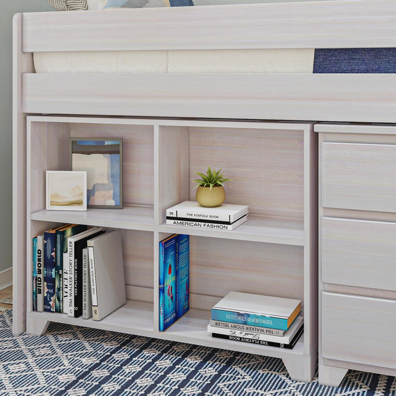 Whitewashed wooden bunk-bed bookshelf with stacked books, framed art, small potted plant and blue patterned rug — modern kids’ bedroom storage and display