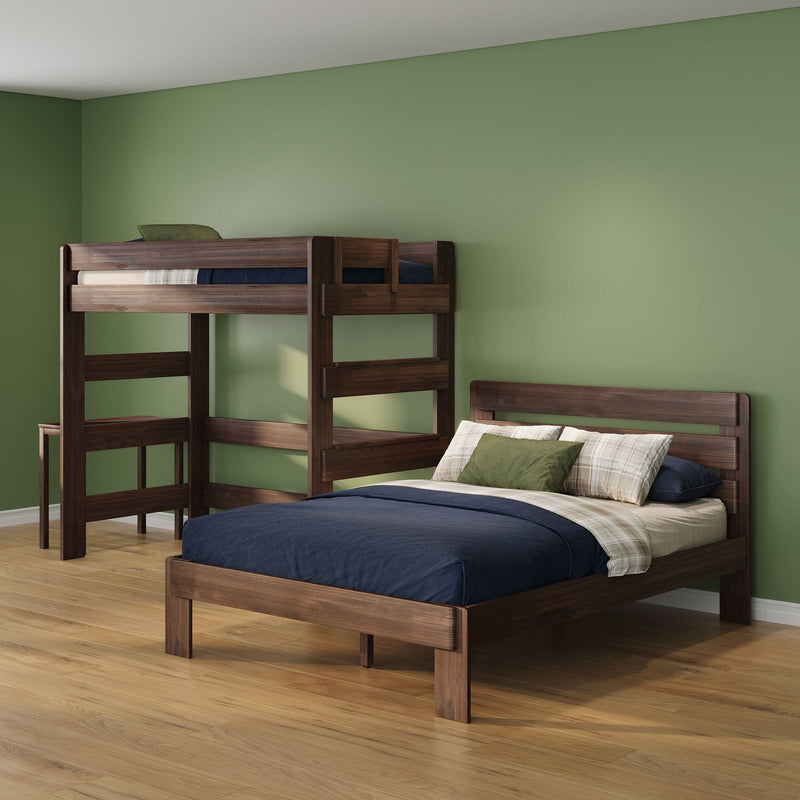Wooden bunk bed with navy bedding and plaid pillows in a green-painted kids' bedroom on hardwood floors