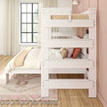 White wooden bunk bed with neutral bedding, textured throw pillows and boho rug in bright kids' bedroom with black grid window and pink accent wall