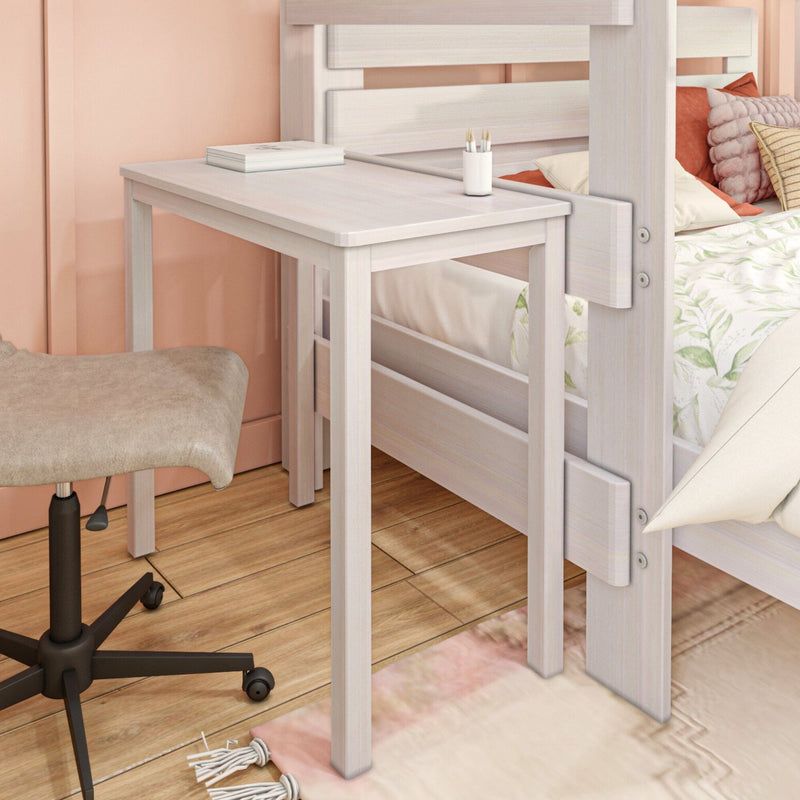 Whitewashed twin bed with integrated fold-out desk and beige swivel chair in a peach-toned compact bedroom with decorative pillows and hardwood floor