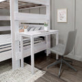 Whitewashed wooden loft bunk bed with integrated desk, grey swivel chair, striped bedding, potted plant and framed floral art in a space-saving kids' bedroom study nook