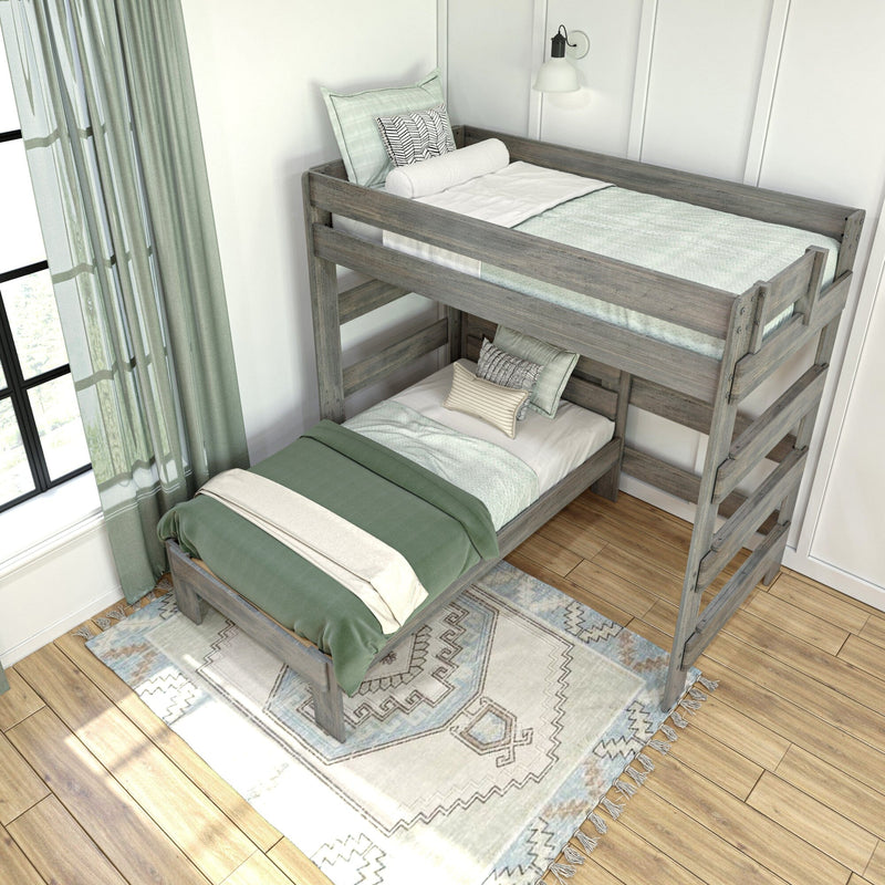 Rustic gray wooden twin bunk beds with sage green bedding, patterned pillows, woven rug and sheer curtains in a bright modern kids' bedroom