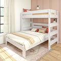 White wooden bunk bed in a modern boho bedroom with neutral linens, rust and blush throw pillows, pink paneled accent wall and sheer window curtains