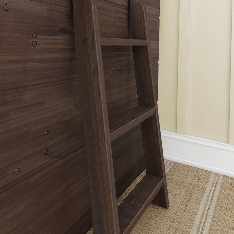 Walnut wooden ladder attached to a dark wood-paneled bed frame next to a beige wall and woven jute rug, modern bedroom detail