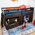 Dark wood kids loft bed with built-in playhouse, storage drawers and ladder, blue bedding and pillows, smiling child playing with red toy truck on colorful patterned area rug