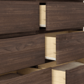 Modern dark walnut dresser with several partially open drawers revealing light maple interiors and wood grain texture