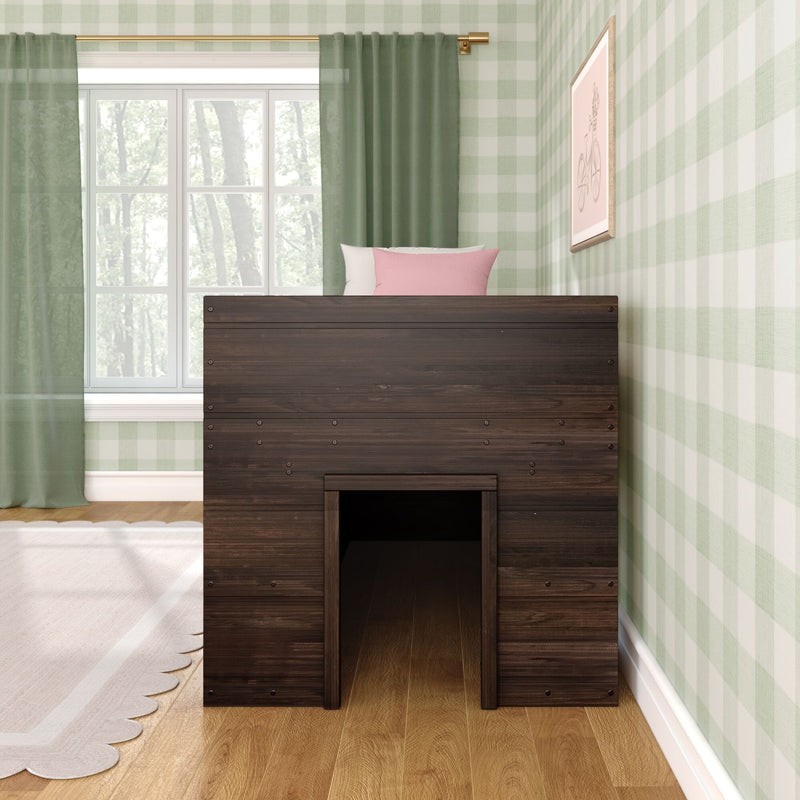 Dark wood kids loft bed with crawl-through opening in a cozy children's bedroom with green gingham wallpaper, sheer green curtains, large window and pink accent pillow