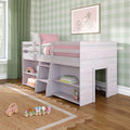 Kids loft bed with built-in storage shelves and ladder, pink bedding, green gingham wallpaper and wooden toys in pastel children's bedroom.