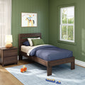 Kids bedroom with green shiplap walls, dark wood twin bed and nightstand, navy bedding, framed cowboy horse print, window and wooden toys