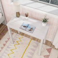 White wooden kids desk and study nook with modern lamp, pencil cup, open picture book and potted plant by window seat, pastel pink wallpaper and patterned boho rug