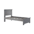 Gray wooden platform bed frame with paneled headboard and slatted mattress support in modern farmhouse style