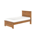 Twin solid wood platform bed with paneled headboard and footboard in warm oak finish with white mattress, modern rustic bedroom furniture