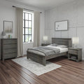 Modern farmhouse bedroom with gray wooden bed and nightstands, neutral bedding, large black-framed window with beige curtains, patterned gray wallpaper and dark hardwood floors
