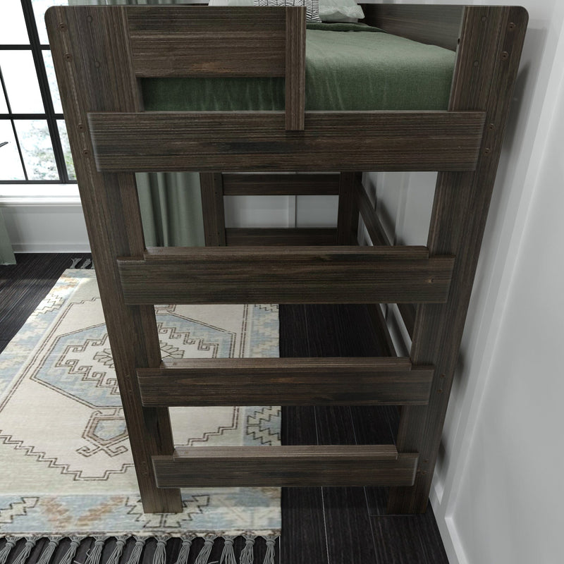 Dark wood bunk bed close-up showing ladder and guardrail, green bedding, patterned rug and window in a modern bedroom