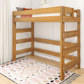 Solid wood loft bunk bed with safety rails and ladder in modern kids' bedroom featuring patterned boho rug and white curtains