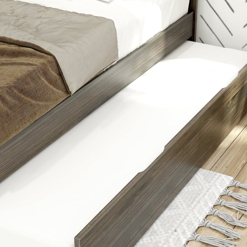 Modern gray wood platform bed with pull-out trundle mattress drawer, beige bedding and textured rug on light wood floor
