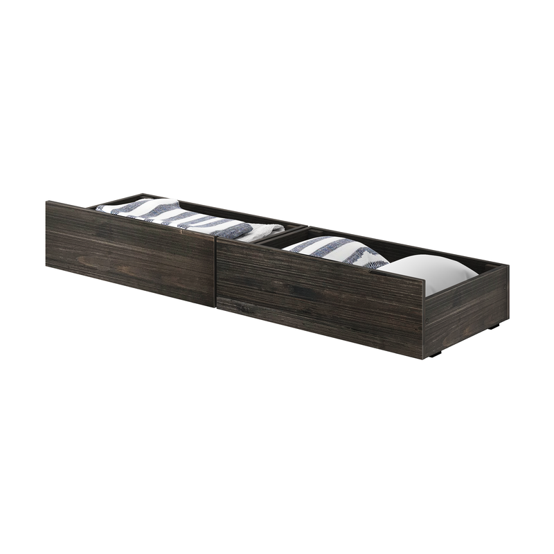 Dark wood underbed storage drawers with pull-out compartments filled with folded striped bedding and linens for bedroom organization