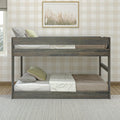 Rustic wooden twin bunk bed in a neutral kids bedroom with beige buffalo check wallpaper, cozy pillows, light green accents, and framed botanical wall art