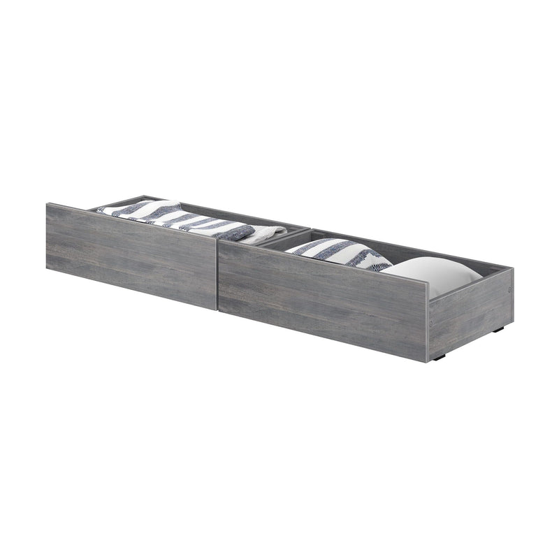 Gray wood under-bed storage drawers with pull-out twin trundle compartments containing pillows and folded blankets — space-saving bedroom storage solution