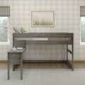 Wooden loft bed with built-in desk and pillows in a modern farmhouse kids' bedroom featuring neutral beige plaid wallpaper, framed pampas grass wall art and window light