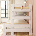 Whitewashed wooden bunk bed in a soft pink kids' bedroom with natural bedding and black grid window