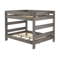 Gray wood twin-over-full bunk bed frame with safety guardrails, slatted mattress supports and rustic gray finish