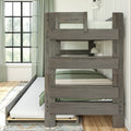 Rustic gray wooden twin-over-twin bunk bed with pull-out trundle, green bedding and curtains, large grid window and wall sconce in a bright modern farmhouse kids' bedroom