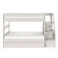 Whitewashed wooden bunk bed with full-size lower bed, top guardrail, built-in staircase with storage drawers and pull-out drawer under bed
