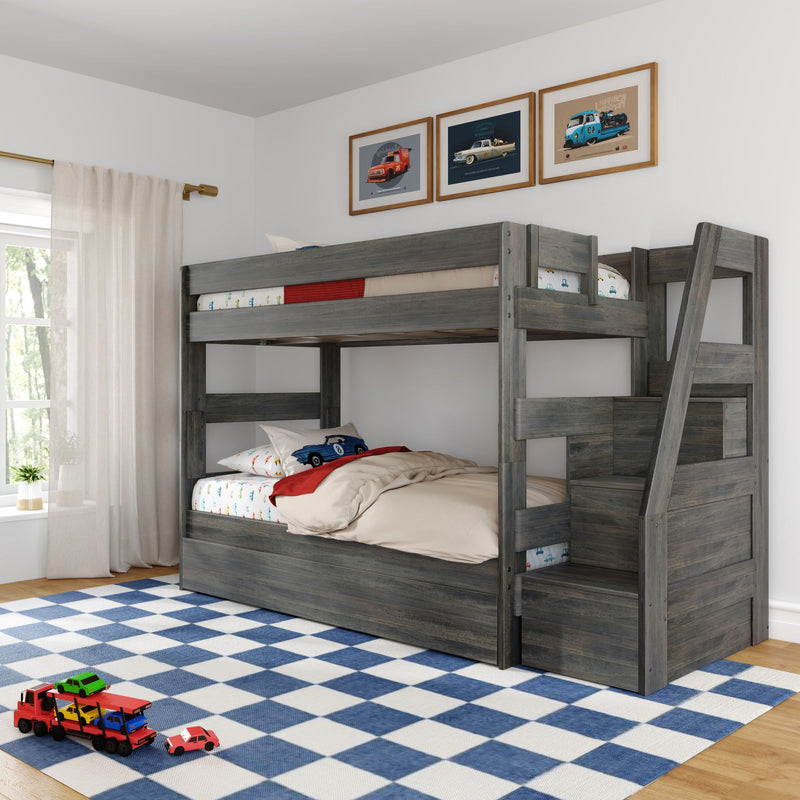 Gray wooden bunk bed with ladder in a children's bedroom, car-themed bedding and pillows, framed vintage car prints, blue check rug and toy car transporter on the floor