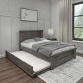 Gray wooden platform bed with pull-out trundle, neutral bedding, nightstand lamp and dandelion wall art in modern farmhouse bedroom with linen curtains and hardwood floors