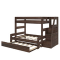 Dark brown solid-wood loft bunk bed with pull-out trundle, integrated storage stairs and slatted mattress supports for a kids' bedroom, rustic finish