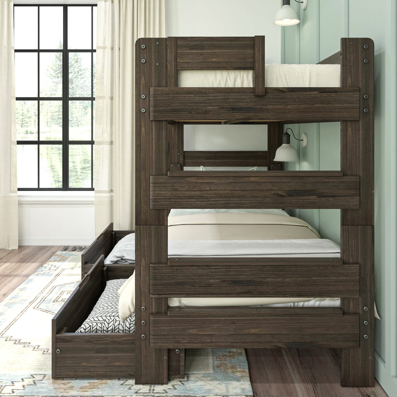 Dark wood twin-over-twin bunk bed with pull-out trundle storage and wall sconce in farmhouse bedroom by grid window