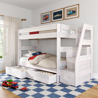 White wooden bunk bed with storage drawers, car-themed bedding and toy cars on a blue checkered rug in a kids' bedroom