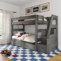 Gray wooden loft bunk bed with car-themed bedding, framed vintage car prints, built-in storage drawers and toy cars on a blue check rug in a kids' bedroom