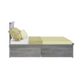 Gray wooden platform bed with sage green duvet and textured pillows, built-in under-bed storage drawers, modern minimalist bedroom furniture