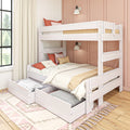 White wooden bunk bed with pull-out storage drawers and trundle, cream and coral bedding, pastel pink paneled bedroom with window and curtains